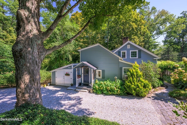 85 E Main St, Stockbridge, MA 01262 - view of front of house featuring a chimney and an outdoor structure