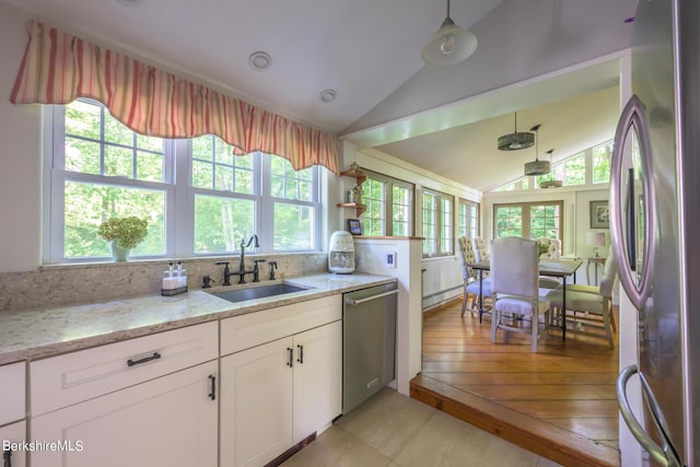85 E Main St, Stockbridge, MA 01262 - kitchen featuring stainless steel appliances, vaulted ceiling, plenty of natural light, a sink, and white cabinets