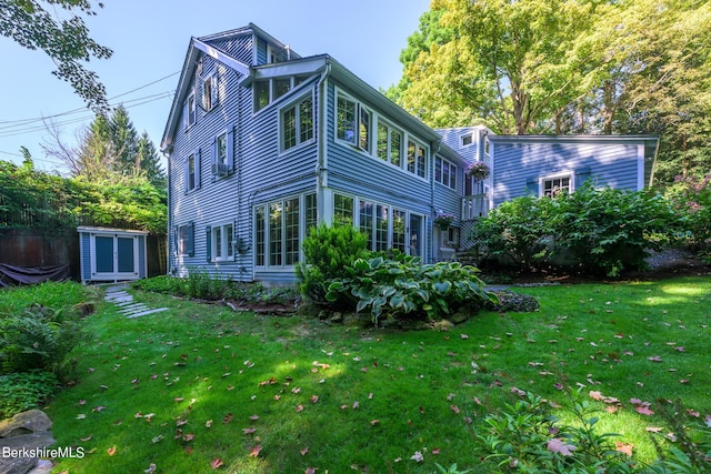 85 E Main St, Stockbridge, MA 01262 - rear view of house featuring a lawn