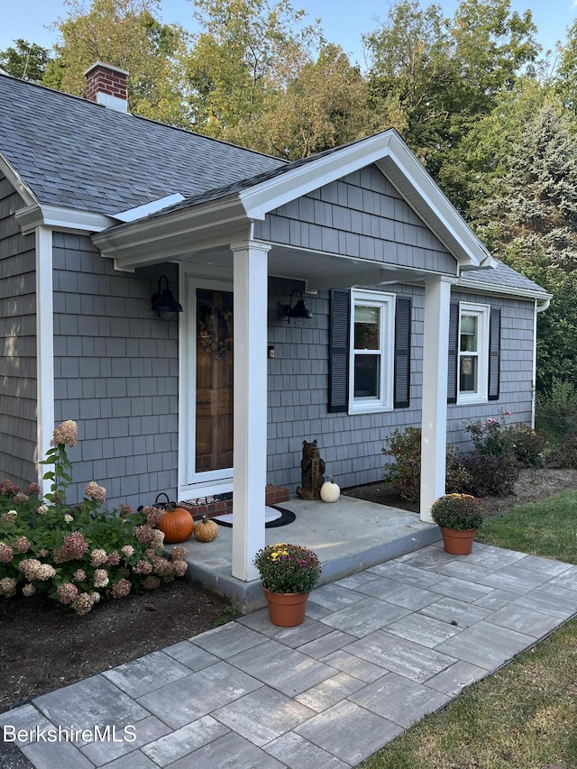 entrance to property featuring covered porch