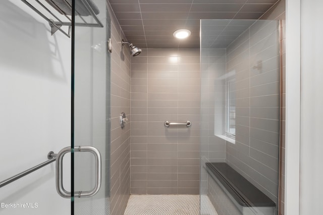 bathroom featuring a stall shower and recessed lighting