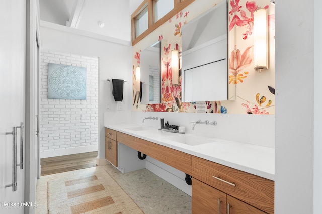full bath with a sink and double vanity