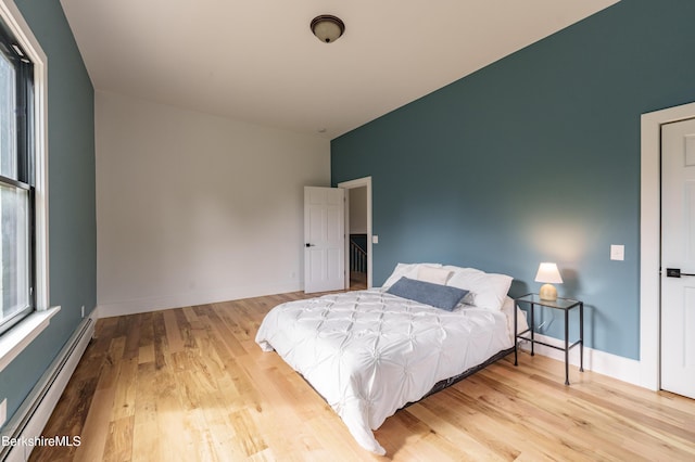 138 Ridge Rd, Worthington, MA 01098 - bedroom featuring baseboard heating and wood finished floors
