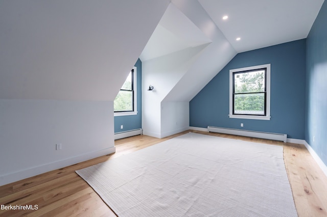 138 Ridge Rd, Worthington, MA 01098 - bonus room with a baseboard heating unit, healthy amount of natural light, wood finished floors, vaulted ceiling, and recessed lighting