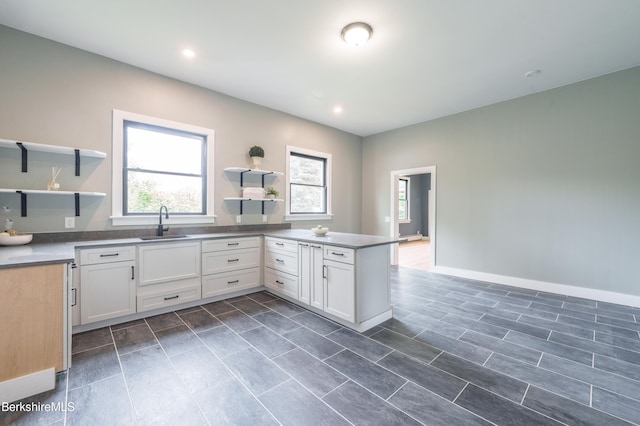 138 Ridge Rd, Worthington, MA 01098 - kitchen with open shelves, a peninsula, white cabinetry, and recessed lighting