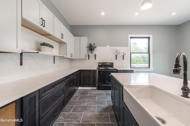 138 Ridge Rd, Worthington, MA 01098 - kitchen featuring black electric range oven, open shelves, white cabinetry, tasteful backsplash, and dark cabinets