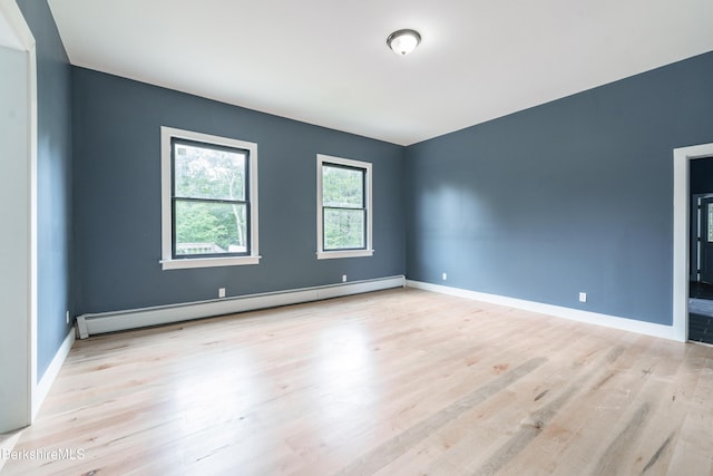138 Ridge Rd, Worthington, MA 01098 - spare room featuring a baseboard heating unit and wood finished floors
