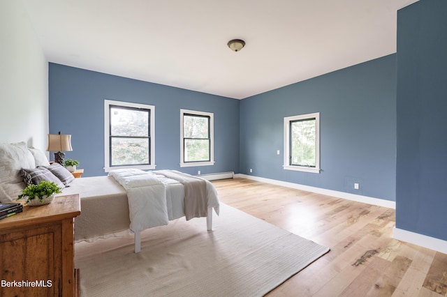 138 Ridge Rd, Worthington, MA 01098 - bedroom featuring light wood-style floors and a baseboard radiator