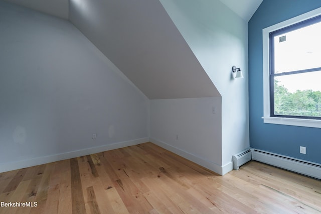 138 Ridge Rd, Worthington, MA 01098 - additional living space with vaulted ceiling, wood finished floors, and baseboard heating