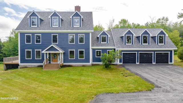 138 Ridge Rd, Worthington, MA 01098 - view of front facade with driveway, a front lawn, a shingled roof, and a chimney