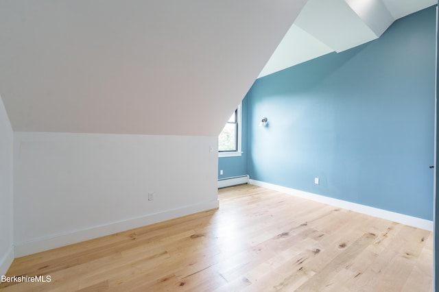 138 Ridge Rd, Worthington, MA 01098 - additional living space featuring a baseboard radiator, vaulted ceiling, and wood finished floors