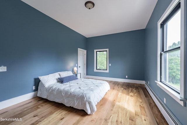 138 Ridge Rd, Worthington, MA 01098 - bedroom with baseboard heating and wood finished floors
