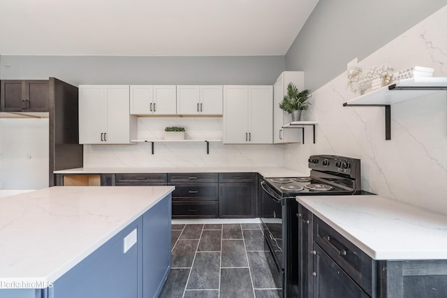 138 Ridge Rd, Worthington, MA 01098 - kitchen with black / electric stove, open shelves, white cabinetry, light stone countertops, and decorative backsplash