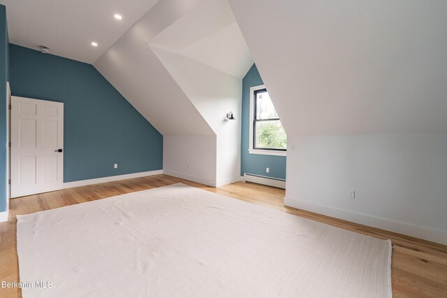 138 Ridge Rd, Worthington, MA 01098 - additional living space with baseboard heating, wood finished floors, vaulted ceiling, and recessed lighting