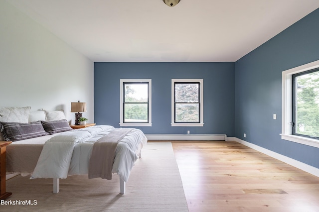 138 Ridge Rd, Worthington, MA 01098 - bedroom featuring a baseboard radiator and light wood-style floors