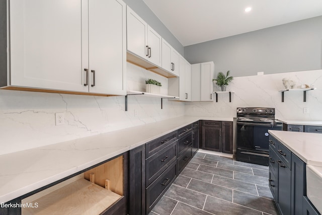 138 Ridge Rd, Worthington, MA 01098 - kitchen featuring open shelves, black range with electric stovetop, white cabinets, backsplash, and light stone counters