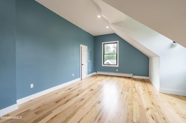 138 Ridge Rd, Worthington, MA 01098 - additional living space with a baseboard heating unit, lofted ceiling, hardwood / wood-style floors, and recessed lighting