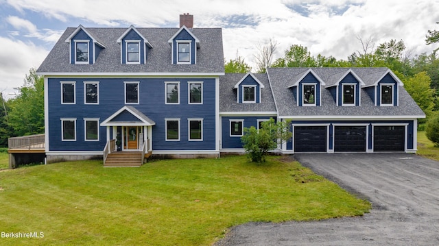 138 Ridge Rd, Worthington, MA 01098 - view of front of house featuring driveway, a front yard, roof with shingles, and a chimney