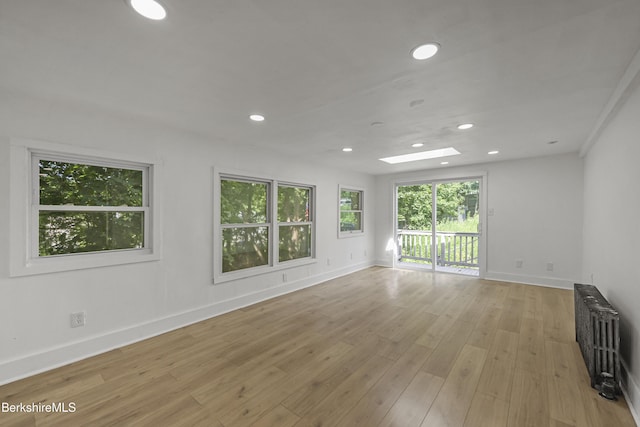 102 Pontoosuc Ave, Pittsfield, MA 01201 - empty room featuring radiator, recessed lighting, and light wood-style floors