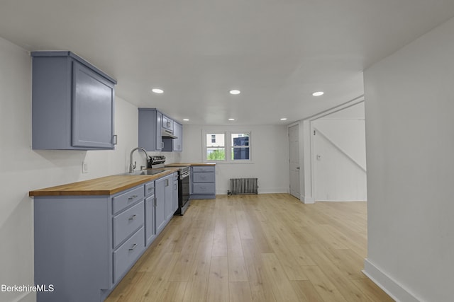 102 Pontoosuc Ave, Pittsfield, MA 01201 - kitchen featuring wood counters, radiator, stainless steel electric range oven, gray cabinetry, and light wood-style flooring