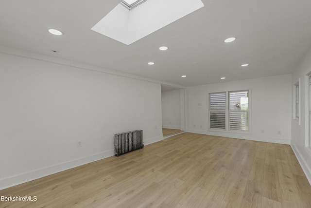 102 Pontoosuc Ave, Pittsfield, MA 01201 - unfurnished room featuring radiator, recessed lighting, light wood-style floors, and a skylight