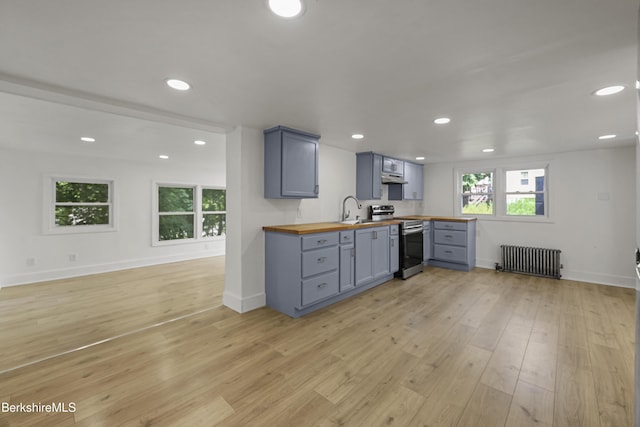 102 Pontoosuc Ave, Pittsfield, MA 01201 - kitchen with radiator, electric stove, wooden counters, gray cabinetry, and light wood-style flooring