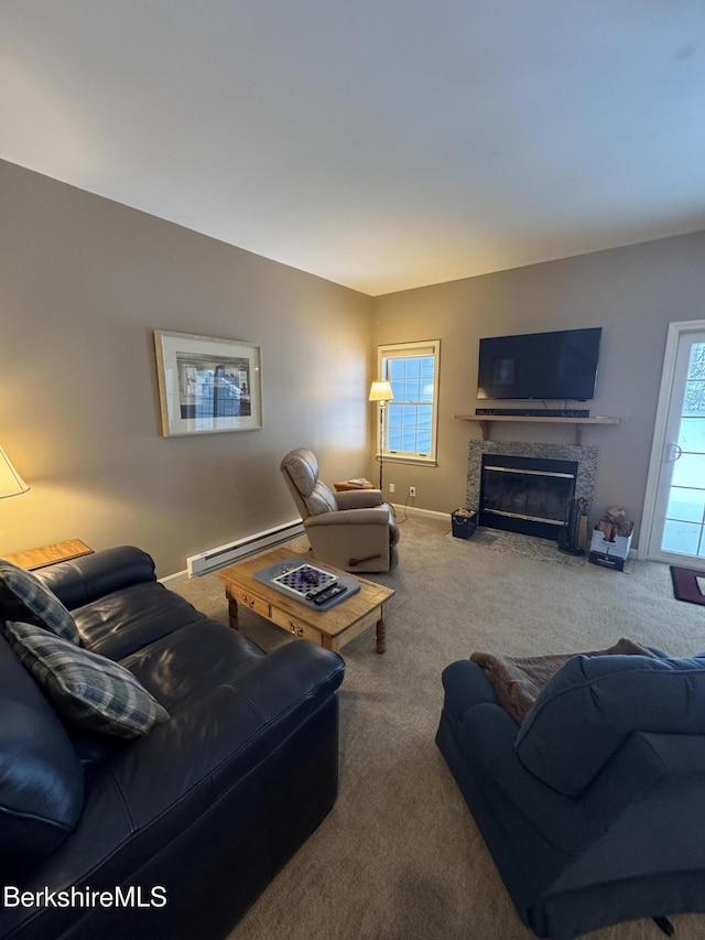 carpeted living room featuring a baseboard radiator