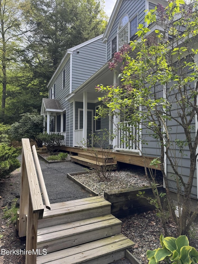 9122 Mountainside Dr, Hancock, MA 01237 - view of side of home with covered porch