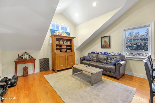 living area with light wood finished floors, recessed lighting, baseboards, and vaulted ceiling