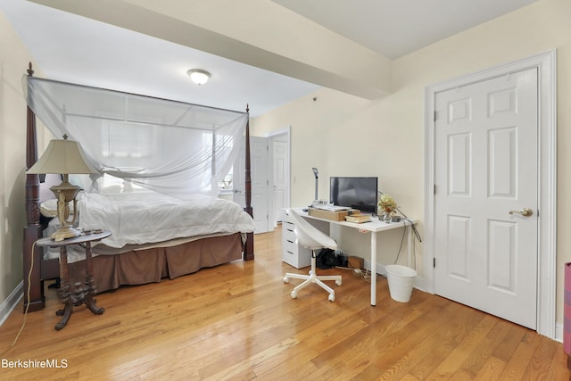 bedroom featuring wood finished floors