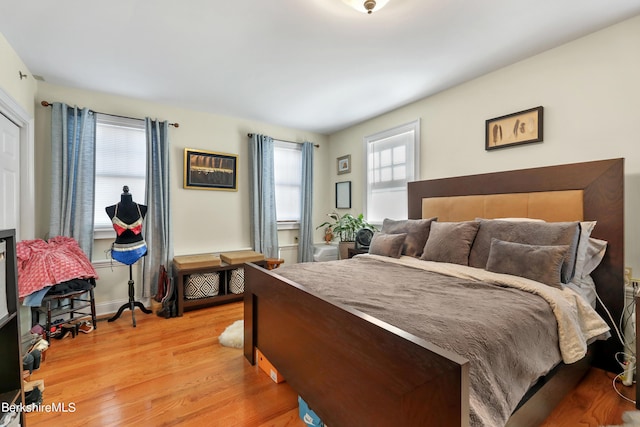 bedroom with light wood finished floors