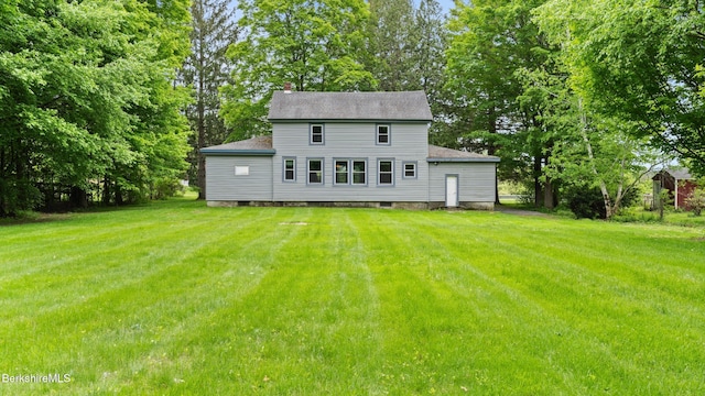 349 New Lenox Rd, Lenox, MA 01240 - back of house with a yard, roof with shingles, and view of wooded area