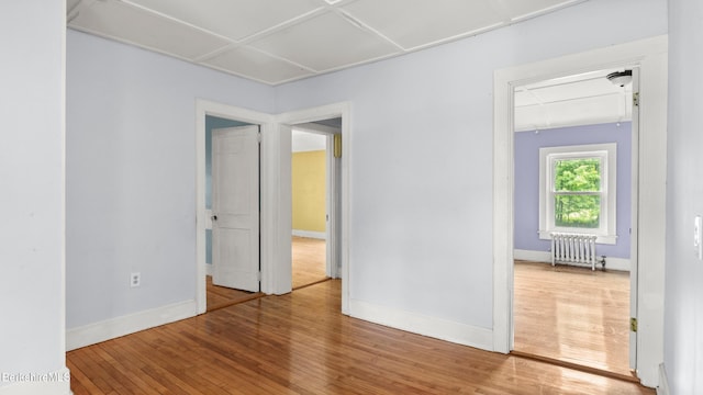 349 New Lenox Rd, Lenox, MA 01240 - empty room featuring radiator, wood finished floors, baseboards, and attic access