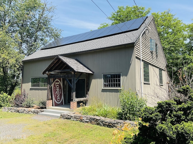 view of front of house featuring solar panels