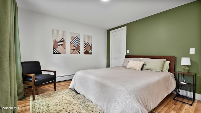 207 S Mountain Rd, Pittsfield, MA 01201 - bedroom featuring light wood-style flooring, a baseboard heating unit, and baseboards