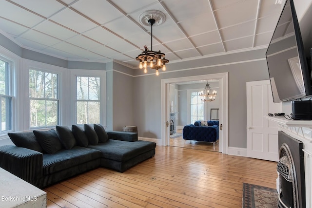 21 Stockbridge Rd, West Stockbridge, MA 01266 - living area featuring a chandelier, healthy amount of natural light, light wood finished floors, baseboards, and ornamental molding