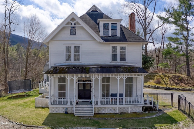 21 Stockbridge Rd, West Stockbridge, MA 01266 - victorian home featuring a trampoline, a porch, a chimney, and roof with shingles