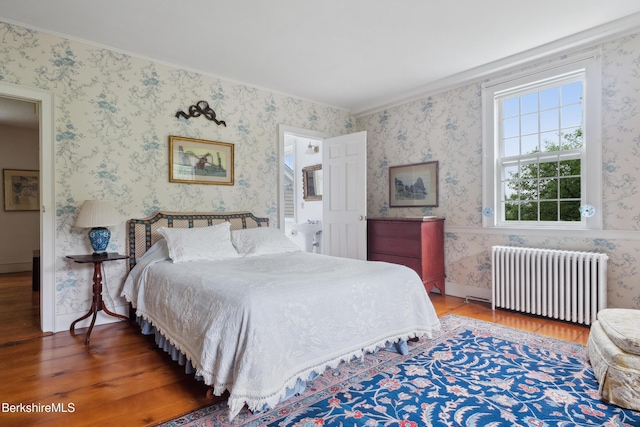 28 Main Rd, Tyringham, MA 01264 - bedroom featuring radiator heating unit, wood finished floors, wallpapered walls, and ornamental molding