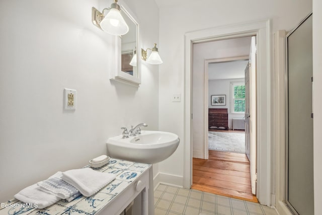28 Main Rd, Tyringham, MA 01264 - full bath featuring radiator heating unit, an enclosed shower, and tile patterned floors