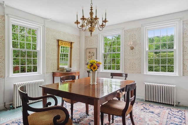 28 Main Rd, Tyringham, MA 01264 - dining area with radiator, wallpapered walls, a chandelier, healthy amount of natural light, and a wainscoted wall