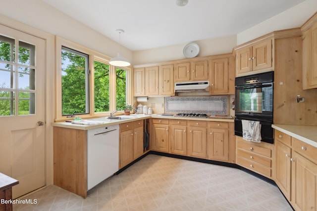 28 Main Rd, Tyringham, MA 01264 - kitchen featuring black oven, a warming drawer, dishwasher, light countertops, and tasteful backsplash