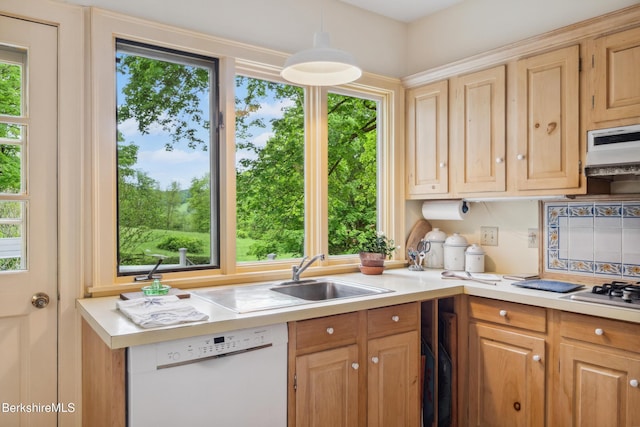 28 Main Rd, Tyringham, MA 01264 - kitchen featuring white dishwasher, light countertops, stainless steel gas stovetop, and hanging light fixtures