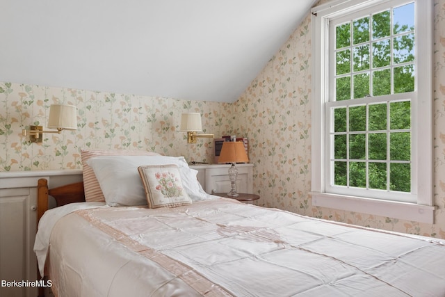 28 Main Rd, Tyringham, MA 01264 - bedroom with wallpapered walls, multiple windows, and vaulted ceiling