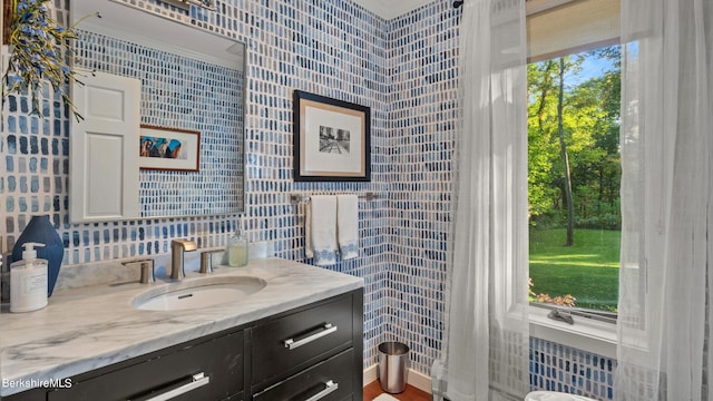 bathroom featuring vanity and crown molding