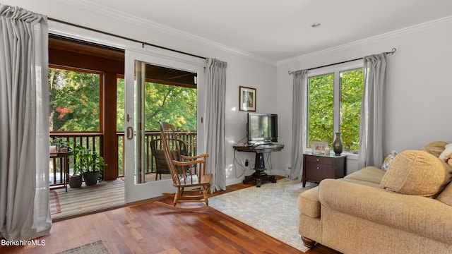 interior space featuring ornamental molding and hardwood / wood-style flooring