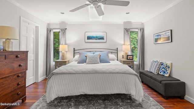 bedroom with dark hardwood / wood-style flooring, ceiling fan, and crown molding