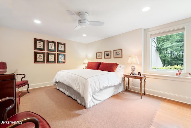 bedroom with hardwood / wood-style flooring and ceiling fan