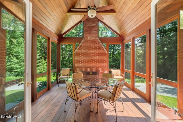 sunroom featuring ceiling fan and lofted ceiling