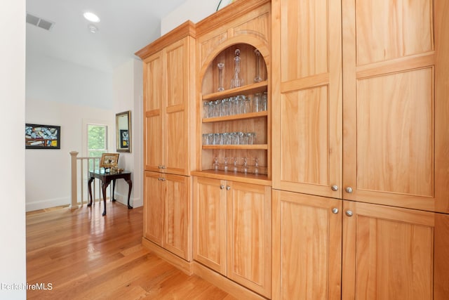 hall with light hardwood / wood-style floors