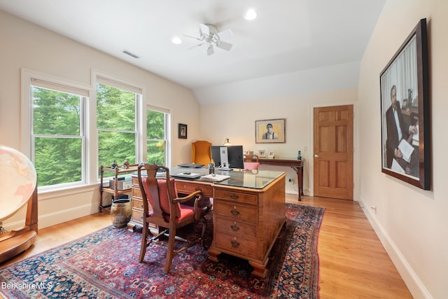 office space featuring ceiling fan, light hardwood / wood-style floors, and lofted ceiling